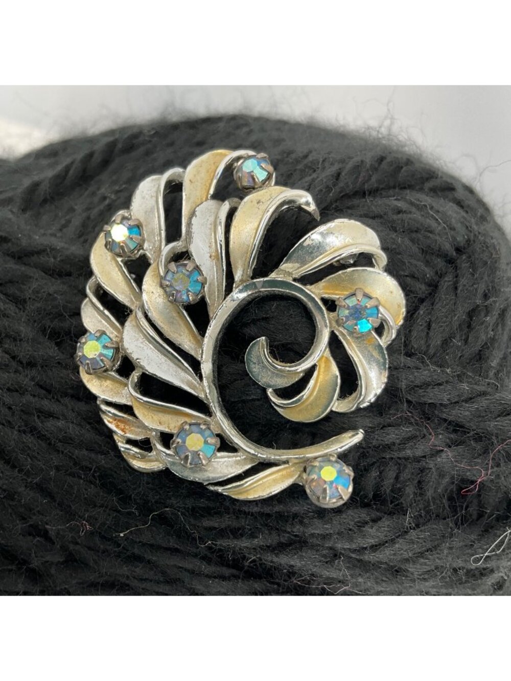 Vintage Silver-Tone Swirl Brooch With Blue Rhinestones & Openwork Design